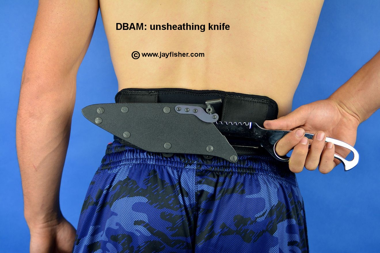 DBAM (Dive Belt Accessory Mount) Knife is being unsheathed from waterproof ...