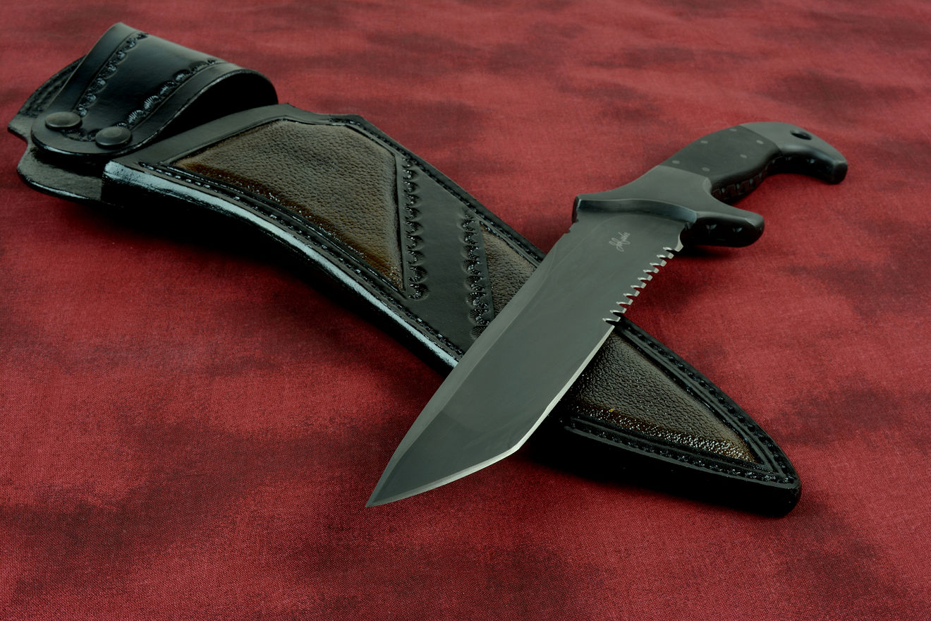 "Taranis" Tactical Counterterrorism Knife in Shadow black treatment of CPMS30V high vanadium stainless steel blade, 304 stainless steel bolsters, G10 fiberglass/epoxy composite handle, hand-carved leather sheath inlaid with buffalo (bison) skin